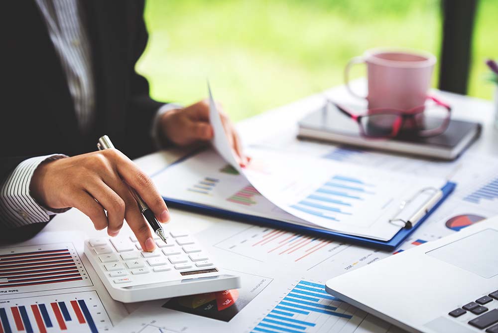 Close-up,Shot,Of,Woman,Pressing,A,Calculator,To,Review,And