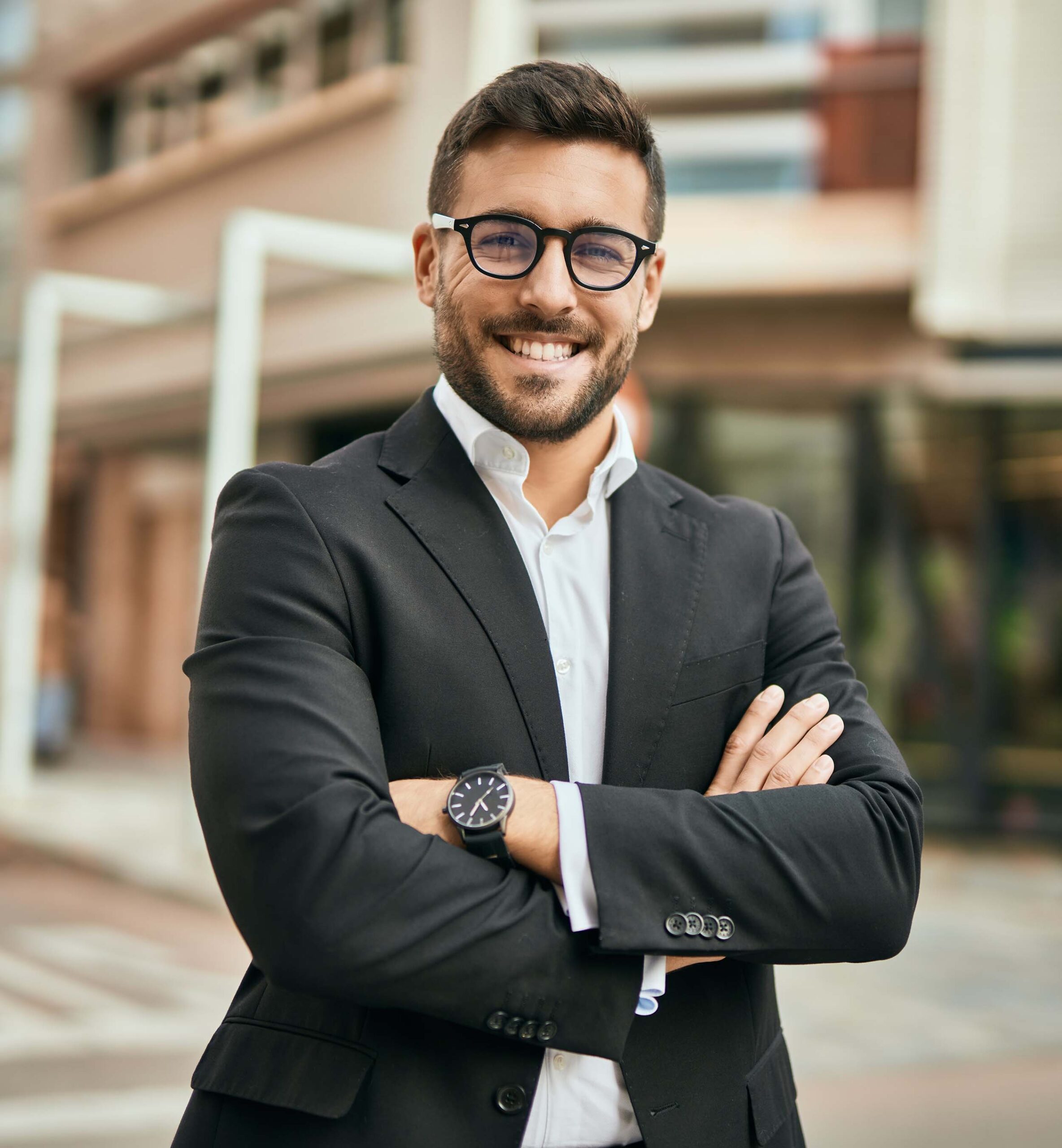 Young,Hispanic,Businessman,With,Arms,Crossed,Smiling,Happy,At,The