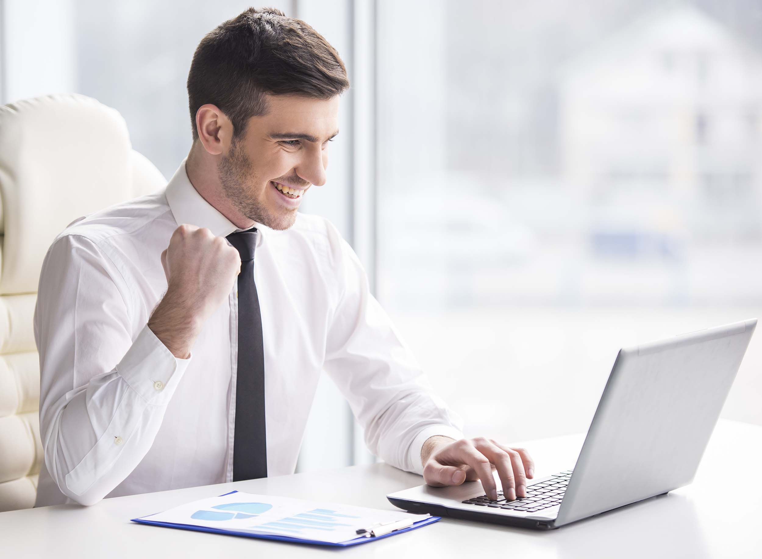 Young,,Happy,Businessman,Is,Working,In,His,Office.